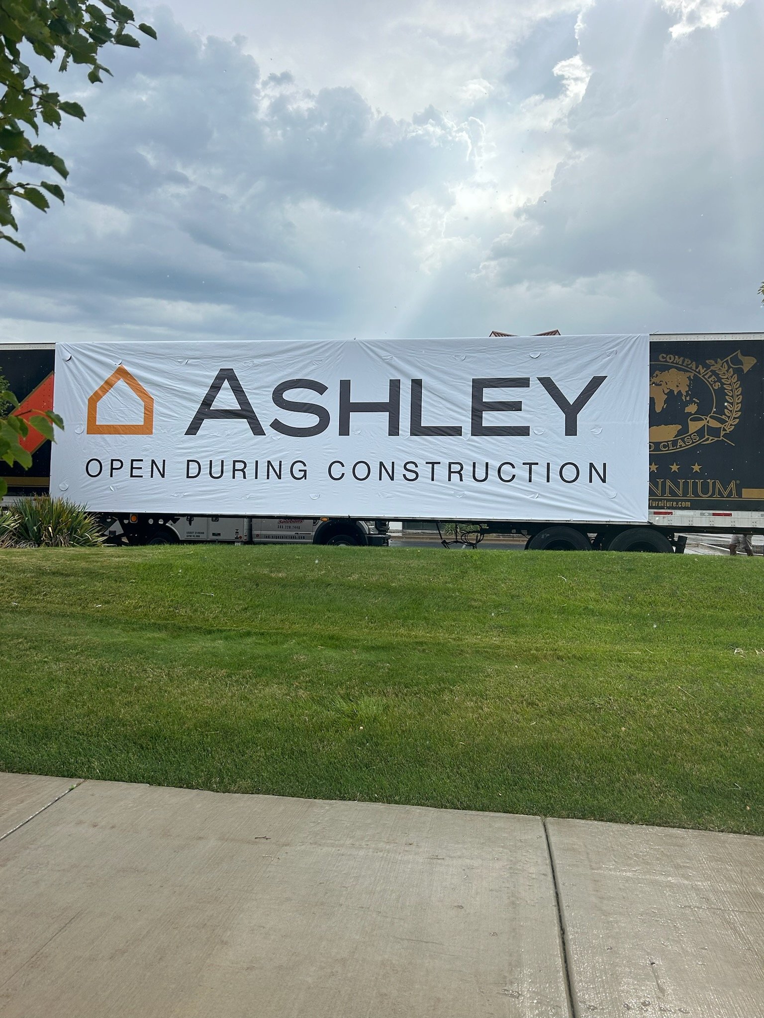 Ashley store banner open during construction
